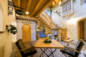 a dining room with a table and chairs in a building at Hotel Tirolerhof in Flachau