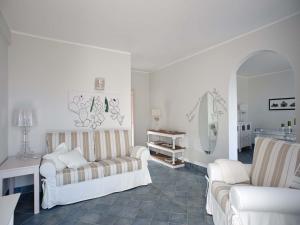 a living room with two couches and a mirror at Le Ruve Bianche in Vibonati +123 photos