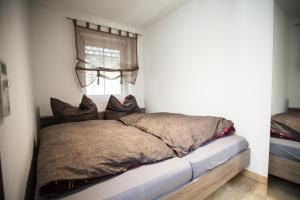 Säng eller sängar i ett rum på Weinberghaus Prossen