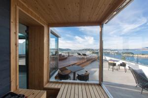 a house with a view of the ocean at Hotel Cala Moresca in Bacoli
