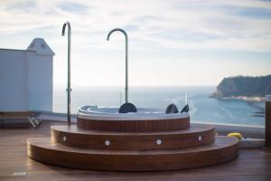 a circular object on a floor with a view of the ocean at Hotel Cala Moresca in Bacoli