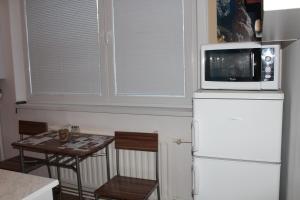 Kuchyň nebo kuchyňský kout v ubytování Apartman David