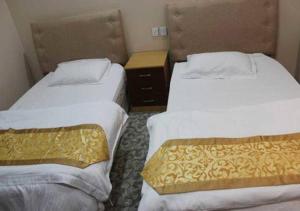 Posteľ alebo postele v izbe v ubytovaní Almasah Altaj Aparthotel
