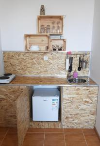 Kuchyň nebo kuchyňský kout v ubytování Apartman Lena