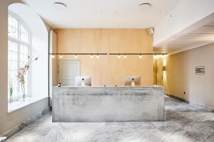 a large bathroom with a marble counter top at Nobis Hotel Copenhagen, a Member of Design Hotels™ in Copenhagen