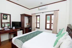 TV a/nebo společenská místnost v ubytování Luang Prabang Legend Hotel
