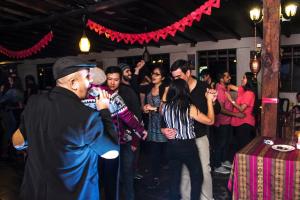 a group of people dancing at a party at Hosteria Pampallacta in Papallacta