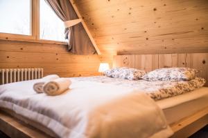 Posteľ alebo postele v izbe v ubytovaní Osada domków TATRA-DREAM