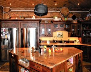 a kitchen with a large island in the middle at McDonald's Ranch Lodge in Gardiner