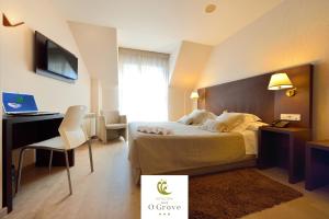 TV a/nebo společenská místnost v ubytování Hotel Spa Norat O Grove 3* Superior