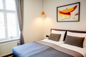 Ένα ή περισσότερα κρεβάτια σε δωμάτιο στο Zagreb City Vibe Apartments & Rooms