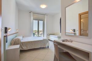 Posteľ alebo postele v izbe v ubytovaní Hotel Amedea