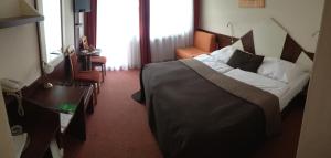 Postel nebo postele na pokoji v ubytování Holiday Park Orava - Hotel Orava