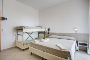 Posteľ alebo postele v izbe v ubytovaní Hotel Amedea