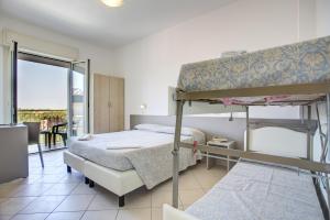 Posteľ alebo postele v izbe v ubytovaní Hotel Amedea