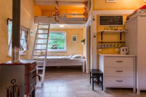 a room with a bed and a desk and a ladder at House Gabrijel with four seasons outdoor kitchen in Bled