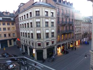 a large white building in the middle of a city at Bleu Mésange - 2 Bedrooms and 2 Bathrooms in Strasbourg