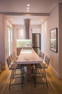 a dining room with a large table and chairs at Elegant House Under Acropolis in Athens