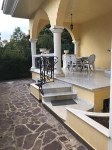 a patio with a table and chairs on a house at Stefano's House in Rimini