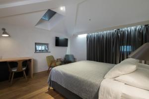 Ένα ή περισσότερα κρεβάτια σε δωμάτιο στο Hotel Peteani