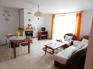 a living room with a couch and a table at Apartmany Tania in Závažná Poruba