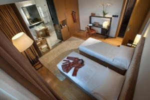 Postel nebo postele na pokoji v ubytování Principe Forte Dei Marmi - Resort & Spa