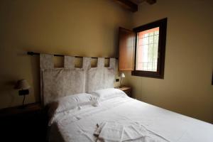 Postel nebo postele na pokoji v ubytování Corte Stellata Holiday Apartments