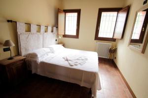 Postel nebo postele na pokoji v ubytování Corte Stellata Holiday Apartments