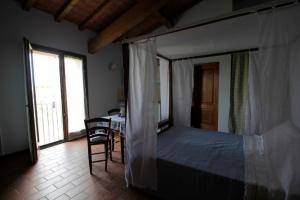 Postel nebo postele na pokoji v ubytování Corte Stellata Holiday Apartments