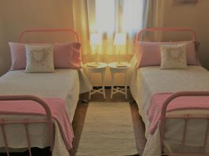 two beds sitting next to each other in a room at Villa Strelitzia Gran Canaria in Ingenio