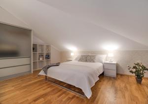 Postel nebo postele na pokoji v ubytování Rooftop Apartments