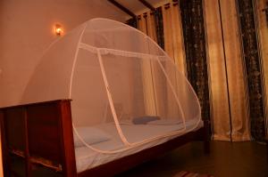 A bed or beds in a room at Lilly Palace Villa Guest House