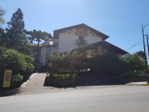 a house on the side of a street at Residencial Pousada do Serrano in Gramado