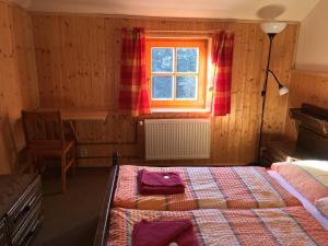 a bedroom with two beds and a window at Horský hotel Portáš in Nový Hrozenkov +19 photos