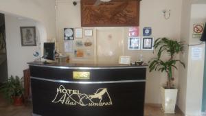a hotel la jolla lobby with a reception counter at Hotel Altas Cumbres in Villa Carlos Paz