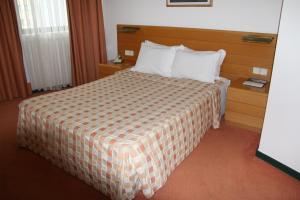 Postel nebo postele na pokoji v ubytování Hotel Douro