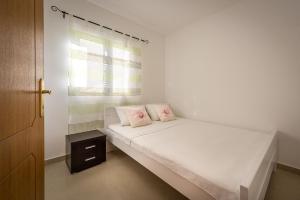 Ένα ή περισσότερα κρεβάτια σε δωμάτιο στο Apartments Mon Beach