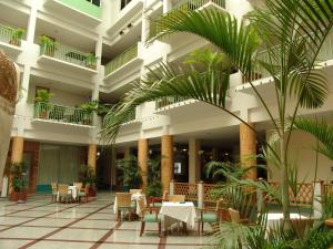 A restaurant or other place to eat at Dhevaraj Hotel