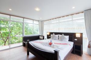 Cama o camas de una habitación en Lanta Nice Beach House