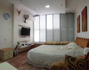 Krevet ili kreveti u jedinici u okviru objekta Ezore Yam Apartmens - Elmali'akh St. 4