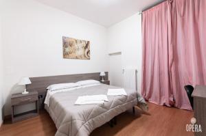 Postel nebo postele na pokoji v ubytování Opera B&B