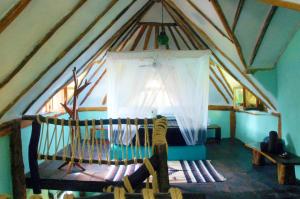 a room with a bed in a tent at Cabañas La Luna in Tulum