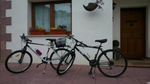 two bikes parked in front of a house at GURE-LUR casa rural in Sumbilla