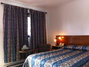 מיטה או מיטות בחדר ב-Motel Ritz