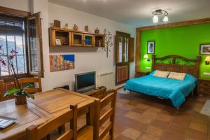 Posteľ alebo postele v izbe v ubytovaní Apartamentos San Martin