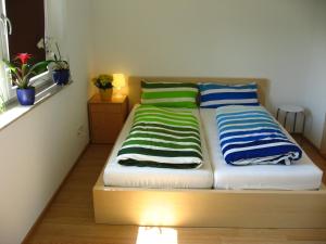 A bed or beds in a room at Apart Panoramablick