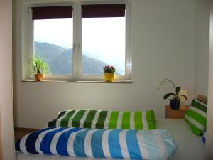 A bed or beds in a room at Apart Panoramablick