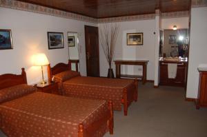 Tempat tidur dalam kamar di Posada Fueguina