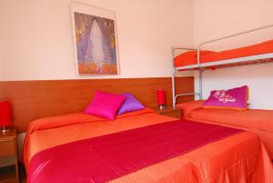 En eller flere senge i et værelse på Residence Condominio ROMA