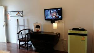 A television and/or entertainment centre at Sleep Hotel - SHA Certified
